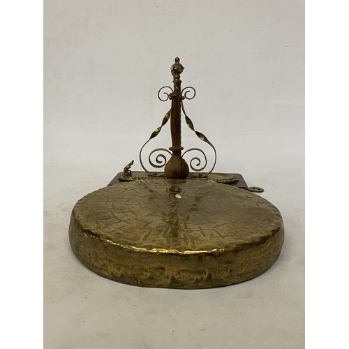 37 - A VINTAGE BURMESE BRASS WALL HANGING GONG AND STRIKER