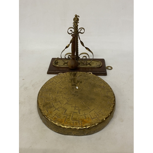 37 - A VINTAGE BURMESE BRASS WALL HANGING GONG AND STRIKER