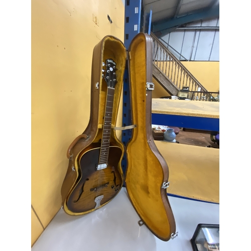 43 - AN ARTISAN ELECTRIC GUITAR WITH A HARD CASE - REPAIR TO THE HEADSTOCK