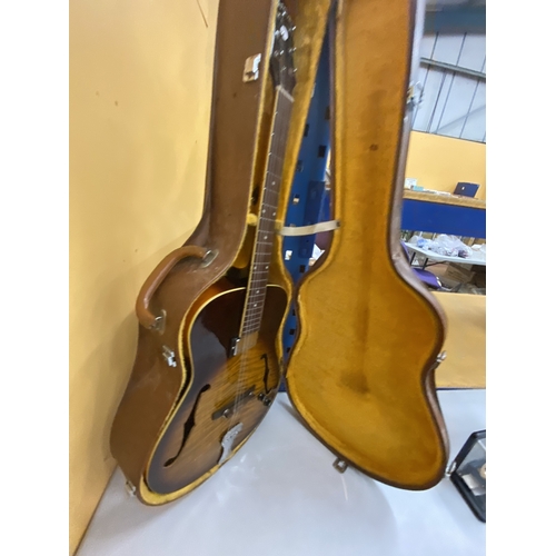 43 - AN ARTISAN ELECTRIC GUITAR WITH A HARD CASE - REPAIR TO THE HEADSTOCK