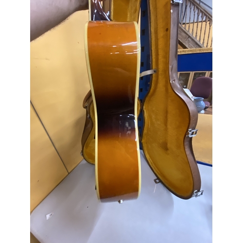 43 - AN ARTISAN ELECTRIC GUITAR WITH A HARD CASE - REPAIR TO THE HEADSTOCK