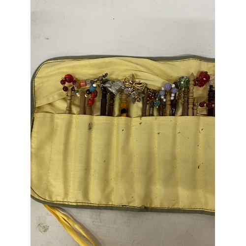 44 - A COLLECTION OF APPROX 46 WOODEN LACE MAKING BOBBINS WITH CHARMS AND SPANGLES