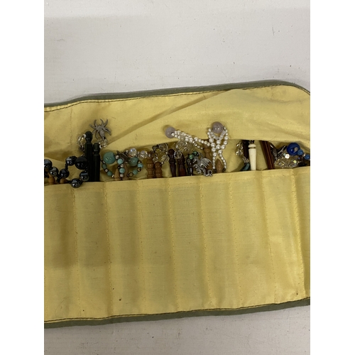 44 - A COLLECTION OF APPROX 46 WOODEN LACE MAKING BOBBINS WITH CHARMS AND SPANGLES