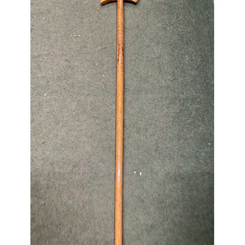 45 - A WOODEN WALKING STICK WITH NORDIC REINDEER DESIGN AND ICE PICK STYLE HANDLE