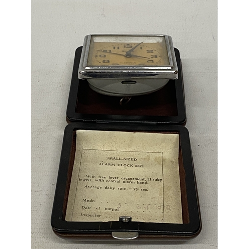 46 - A VINTAGE RUSSIAN SLAVA CASED TRAVEL ALARM CLOCK
