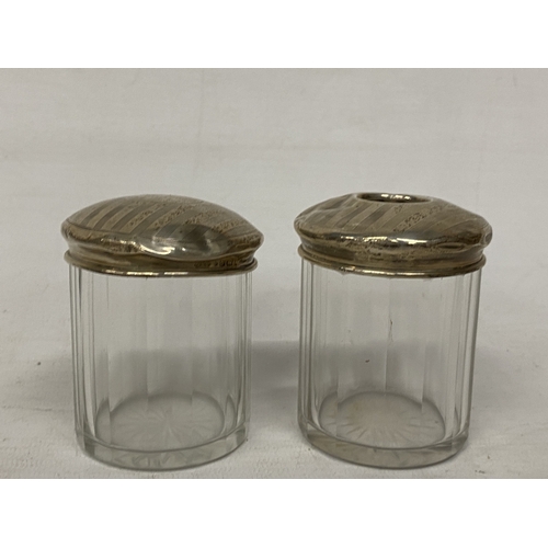 52 - TWO GLASS AND HALLMARKED BIRMINGHAM SILVER DRESSING TABLE JARS