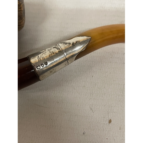 19 - A VINTAGE CARVED MEERSCHAUM SMOKING PIPE WITH THE BOWL CARVED AS A BEARDED MAN'S HEAD WITH AN AMBER ... 
