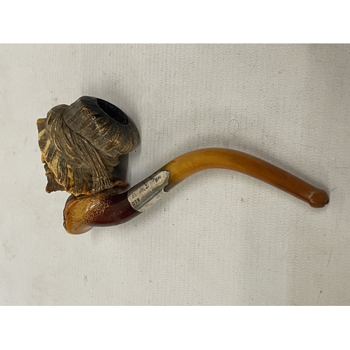 19 - A VINTAGE CARVED MEERSCHAUM SMOKING PIPE WITH THE BOWL CARVED AS A BEARDED MAN'S HEAD WITH AN AMBER ... 