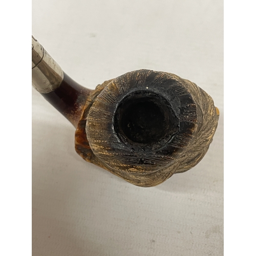 19 - A VINTAGE CARVED MEERSCHAUM SMOKING PIPE WITH THE BOWL CARVED AS A BEARDED MAN'S HEAD WITH AN AMBER ... 