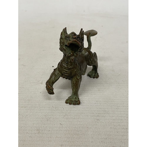 52 - AN ORIENTAL BRONZE DRAGON FIGURE