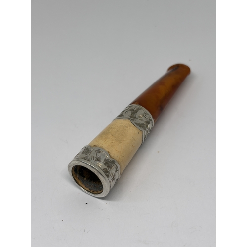81 - A HALLMARKED CHESTER SILVER AND AMBER CHEROOT HOLDER