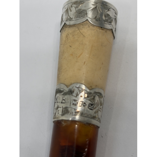 81 - A HALLMARKED CHESTER SILVER AND AMBER CHEROOT HOLDER