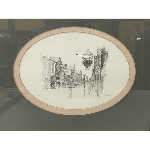 90 - A FRAMED AND OVAL MOUNTED MONOCHROME SKETCH OF A TOWNSCAPE BY WILLIAM GELDART - 32 X 28 CM
