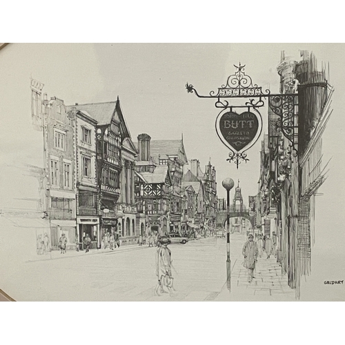 90 - A FRAMED AND OVAL MOUNTED MONOCHROME SKETCH OF A TOWNSCAPE BY WILLIAM GELDART - 32 X 28 CM