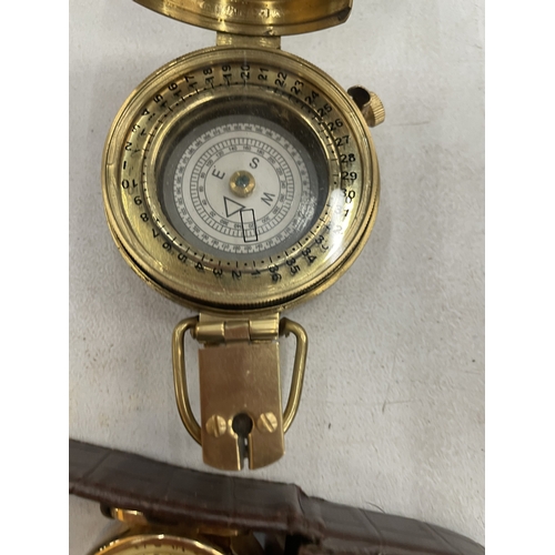 115 - A BRASS COMPASS AND A SMALL CASED CLOCK