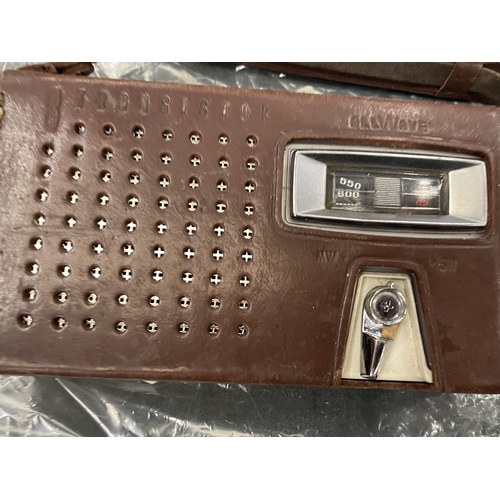 156 - A VINTAGE SANYO TRANSISTOR RADIO WITH ANTENNA AND EARPHONES