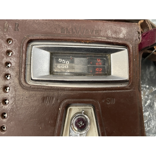 156 - A VINTAGE SANYO TRANSISTOR RADIO WITH ANTENNA AND EARPHONES