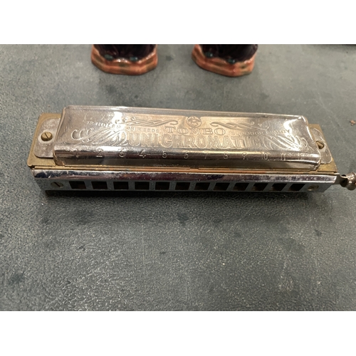 166 - A VINTAGE HARMONICA