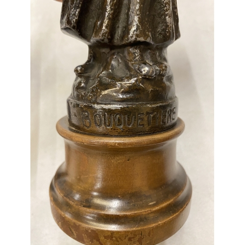 179 - A SPELTER FIGURE OF A LADY WITH A BASKET, HEIGHT 25CM