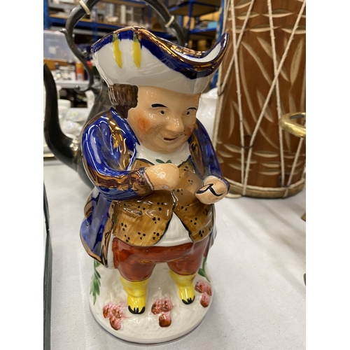 180 - A STAFFORDSHIRE SNUFF TAKER TOBY JUG