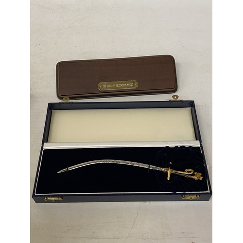 A BOXED MINIATURE DUKE OF WELLINGTON SWORD BY WILKINSON SWORD, LENGTH ...
