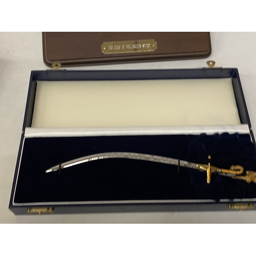 A BOXED MINIATURE DUKE OF WELLINGTON SWORD BY WILKINSON SWORD, LENGTH ...