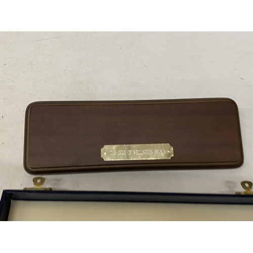 A BOXED MINIATURE DUKE OF WELLINGTON SWORD BY WILKINSON SWORD, LENGTH ...