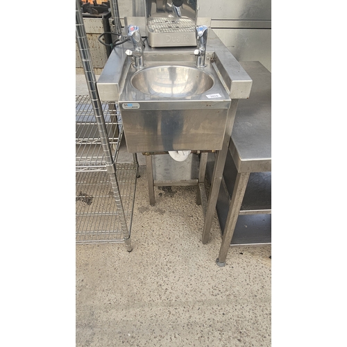 A STAINLESS STEEL HAND SINK