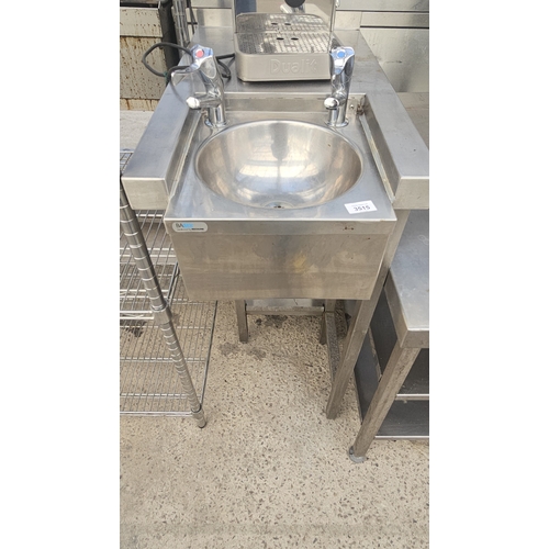 A STAINLESS STEEL HAND SINK