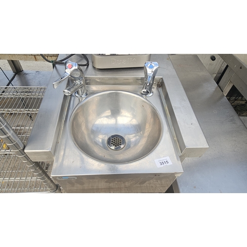 A STAINLESS STEEL HAND SINK