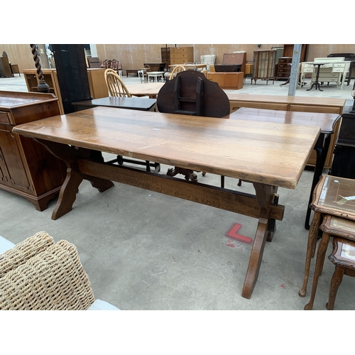 AN OAK REFECTORY TABLE ON X FRAME BASE 70