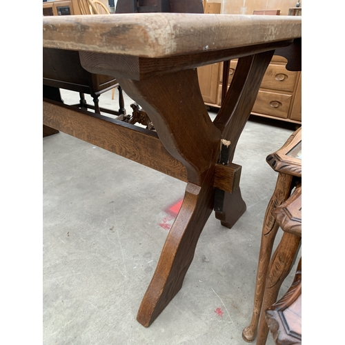 AN OAK REFECTORY TABLE ON X FRAME BASE 70