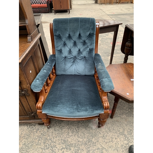 A VICTORIAN MAHOGANY UPHOLSTERED ARM CHAIR WITH BUTTON BACK AND TURNED ...