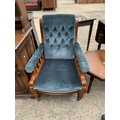 A VICTORIAN MAHOGANY UPHOLSTERED ARM CHAIR WITH BUTTON BACK AND TURNED ...