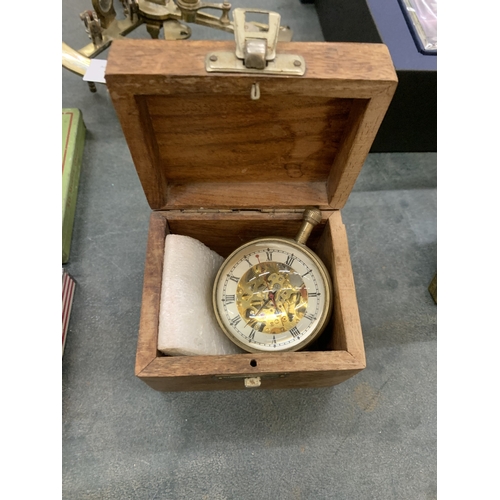 A BUBBLE CLOCK HOUSED IN A WOODEN BOX
