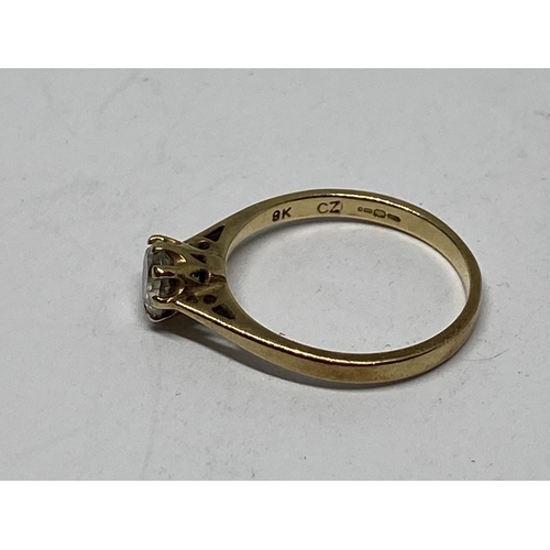 A 9 CARAT GOLD RING WITH SOLITAIRE CUBIC ZIRCONIA SIZE J