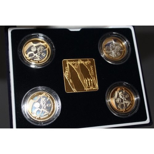 68 - A ROYAL MINT 2002 'COMMONWEALTH GAMES' SILVER PROOF FOUR COIN SET TOGETHER WITH A GOLD PLATED PLAQUE... 