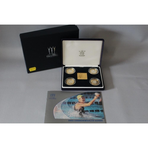 68 - A ROYAL MINT 2002 'COMMONWEALTH GAMES' SILVER PROOF FOUR COIN SET TOGETHER WITH A GOLD PLATED PLAQUE... 