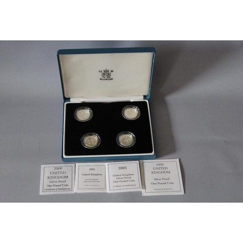 74 - A ROYAL MINT SILVER PROOF £1 FOUR COIN SET, dated 1999, 2000, 2001 and 2002, with COA/Booklet, in or... 