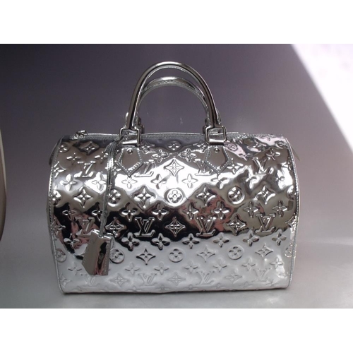 A LOUIS VUITTON SILVER MONOGRAM VERNIS SPEEDY BAG, with double top handle,  padlock and key fob, dust