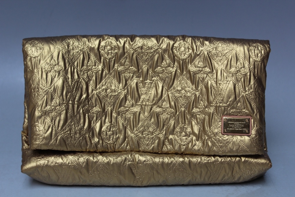 A LOUIS VUITTON QUILTED POUCH GOLD LIMELIGHT CLUTCH BAG, with