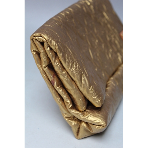 A LOUIS VUITTON QUILTED POUCH GOLD LIMELIGHT CLUTCH BAG, with