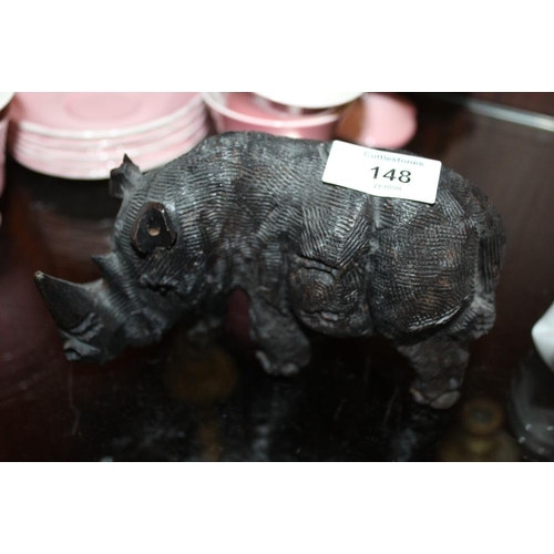 148 - A CARVED WOODEN BLACK FOREST STYLE FIGURE OF A RHINO
