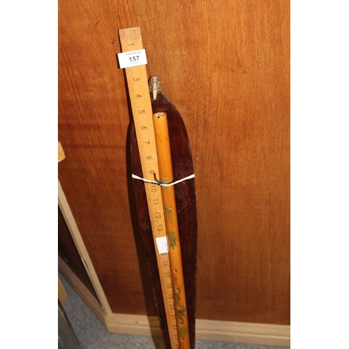 157 - AN UNUSUAL WOOD WIND INSTRUMENT / WALKING CANE, TOGETHER WITH AN ABORIGINAL CARVED PADDLE AND A RULE... 