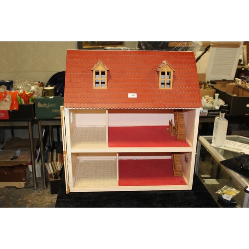 158 - A VINTAGE WOODEN DOLLS HOUSE