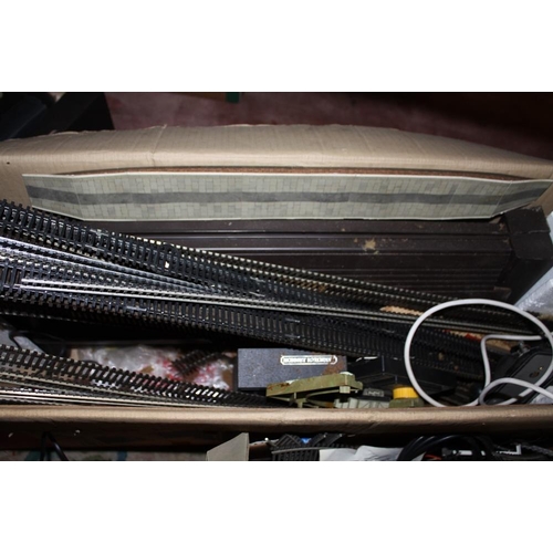 114 - TWO BOXES OF MODEL RAILWAY TRACK AND POWER UNITS TO INCLUDE HORNBY