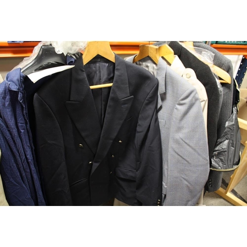 84 - A COLLECTION OF GENTS CLOTHING TO INCLUDE A BUSH OVER COAT, SUITS ETC