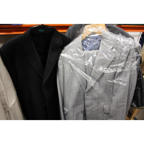 84 - A COLLECTION OF GENTS CLOTHING TO INCLUDE A BUSH OVER COAT, SUITS ETC