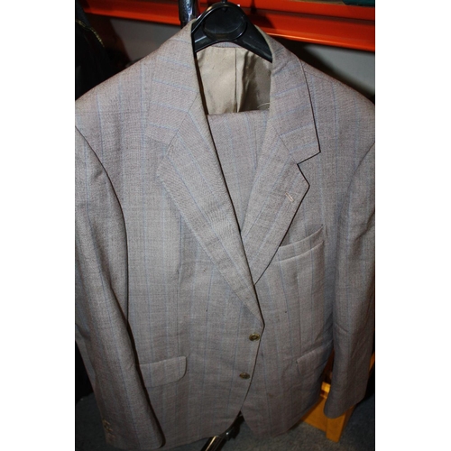 84 - A COLLECTION OF GENTS CLOTHING TO INCLUDE A BUSH OVER COAT, SUITS ETC