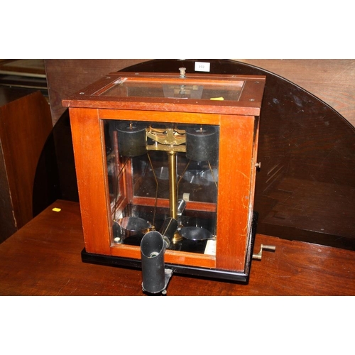 86 - A GLASS AND MAHOGANY CASED SET SCALES BY OERTLING OF LONDON